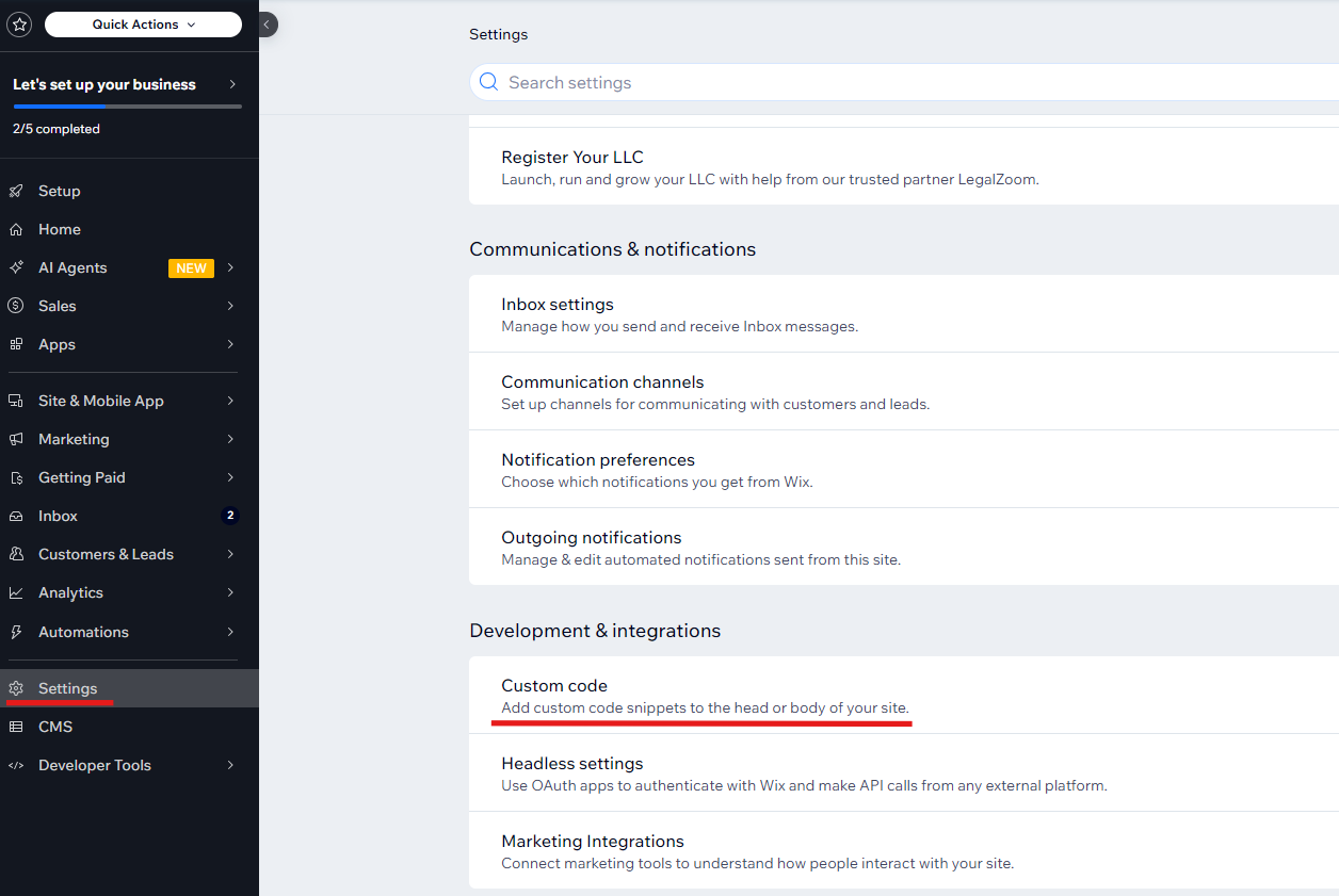 Screenshot of Wix admin panel with Settings and Custom Code highlighted